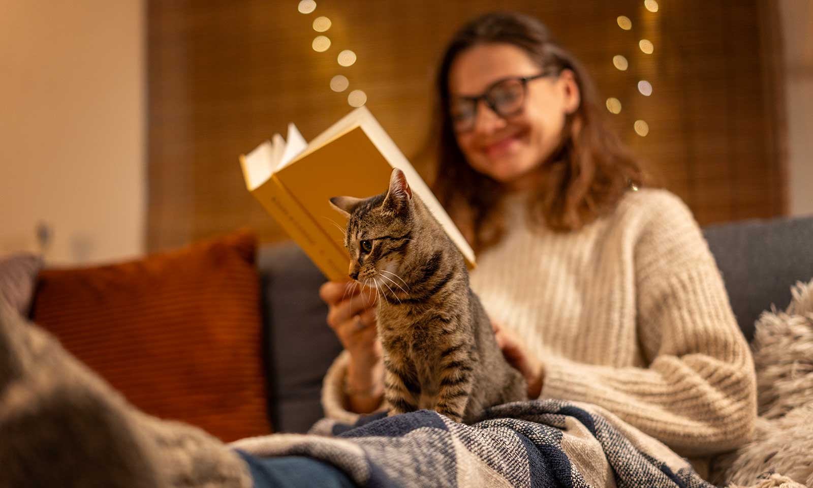 A woman sitting with her cat